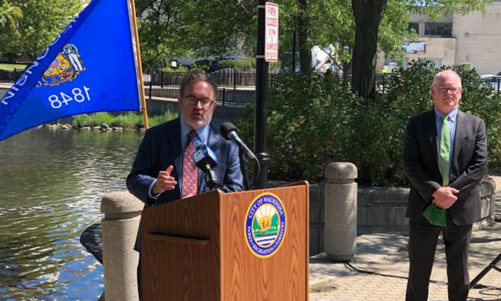 Waukesha Mayor Shawn Reilly looks on as Environmental Protection Agency Administrator Andrew Wheeler addresses the audience at the press conference announcing the WIFIA loan for the Waukesha Clean Water Project.